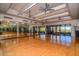Bright fitness center featuring ceiling fans, mirrors, and floor-to-ceiling windows with beautiful exterior views at 6939 E Bramble Berry Ln, Scottsdale, AZ 85266
