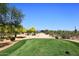Scenic view of the golf course with desert vegetation and distant mountains at 6939 E Bramble Berry Ln, Scottsdale, AZ 85266