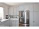 This lovely kitchen includes granite counters, gray cabinets and stainless appliances at 6939 E Bramble Berry Ln, Scottsdale, AZ 85266