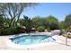 Community hot tub surrounded by desert landscaping, offering a private and relaxing experience at 6939 E Bramble Berry Ln, Scottsdale, AZ 85266