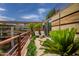 Outdoor balcony showcasing cozy seating and lush landscaping, ideal for relaxation and enjoying the surrounding views at 7141 E Rancho Vista Dr # 6007, Scottsdale, AZ 85251