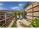 Outdoor terrace with lounge chair, lush plants, manicured exteriors, and a view of the building's modern design at 7141 E Rancho Vista Dr # 6007, Scottsdale, AZ 85251