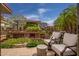 Relaxing outdoor balcony with comfortable seating, lush landscaping, and views of the building exterior at 7141 E Rancho Vista Dr # 6007, Scottsdale, AZ 85251