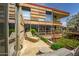 Secluded balcony featuring a lounge chair, lush landscaping, and scenic views of the building's architectural details at 7141 E Rancho Vista Dr # 6007, Scottsdale, AZ 85251