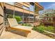 Stylish balcony features a lounger, lush greenery, and a view of the building's striking architectural design at 7141 E Rancho Vista Dr # 6007, Scottsdale, AZ 85251