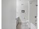 Clean, minimalist bathroom featuring a tub, shower, and modern fixtures with tile walls at 7141 E Rancho Vista Dr # 6007, Scottsdale, AZ 85251