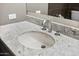 Close-up of a pristine white sink with a marble countertop, and a modern faucet for an elegant and functional bathroom at 7141 E Rancho Vista Dr # 6007, Scottsdale, AZ 85251