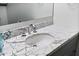 Close-up bathroom vanity featuring an undermount sink, marble countertop, and modern faucet at 7141 E Rancho Vista Dr # 6007, Scottsdale, AZ 85251