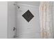 Well-lit bathroom features a showerhead, decorative diamond tile, and elegant shower curtain for a luxurious bathing experience at 7141 E Rancho Vista Dr # 6007, Scottsdale, AZ 85251