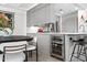 Open dining area adjacent to the kitchen, featuring a dark wood table and modern lighting at 7141 E Rancho Vista Dr # 6007, Scottsdale, AZ 85251