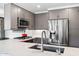 Well-equipped kitchen with stainless steel appliances and gray cabinetry, highlighting contemporary design at 7141 E Rancho Vista Dr # 6007, Scottsdale, AZ 85251