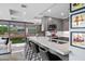 Modern kitchen with a quartz countertop island, stainless steel appliances, and a view to the patio at 7141 E Rancho Vista Dr # 6007, Scottsdale, AZ 85251