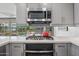 This kitchen features a sleek stainless steel microwave above a modern gas cooktop and oven at 7141 E Rancho Vista Dr # 6007, Scottsdale, AZ 85251