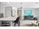Stylish kitchen island with bar seating and a wine cooler, adding luxury to the space at 7141 E Rancho Vista Dr # 6007, Scottsdale, AZ 85251