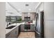 Modern kitchen with gray cabinets, stainless steel appliances, and quartz countertops, offering a sleek design at 7141 E Rancho Vista Dr # 6007, Scottsdale, AZ 85251
