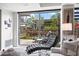 Bright living room featuring a relaxing lounge area with a view of a green outdoor space with trees and plants at 7141 E Rancho Vista Dr # 6007, Scottsdale, AZ 85251