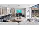 Spacious living area featuring contemporary design, a large entertainment system, and an open view to the outside at 7141 E Rancho Vista Dr # 6007, Scottsdale, AZ 85251