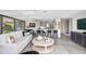 Open living space flows into the dining area and kitchen, featuring bar seating and modern finishes at 7141 E Rancho Vista Dr # 6007, Scottsdale, AZ 85251