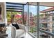 Comfortable living room with a cozy armchair and floor to ceiling windows showing the building's manicured exterior at 7141 E Rancho Vista Dr # 6007, Scottsdale, AZ 85251