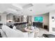 Combined kitchen and living room featuring bar seating, stainless steel appliances, and a cozy, modern aesthetic at 7141 E Rancho Vista Dr # 6007, Scottsdale, AZ 85251