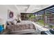 Luminous bedroom with floor-to-ceiling windows offering panoramic views of the surrounding greenery and skyline at 7141 E Rancho Vista Dr # 6007, Scottsdale, AZ 85251