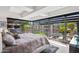 Bright bedroom boasts expansive windows with lush views, complemented by stylish decor and a cozy rug at 7141 E Rancho Vista Dr # 6007, Scottsdale, AZ 85251