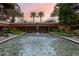Scenic water feature with a waterfall, surrounded by lush greenery and modern architecture at 7141 E Rancho Vista Dr # 6007, Scottsdale, AZ 85251