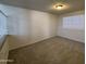 Cozy bedroom with neutral carpet, blinds and natural light from window at 7905 W Thunderbird Rd # 305, Peoria, AZ 85381