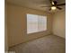 Carpeted bedroom with a ceiling fan and a window, creating a calm atmosphere at 7905 W Thunderbird Rd # 305, Peoria, AZ 85381