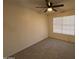 Bedroom showcasing neutral carpet, ceiling fan, and window with blinds for natural light at 7905 W Thunderbird Rd # 305, Peoria, AZ 85381