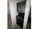Compact laundry area with stacked washer and dryer inside a utility closet at 7905 W Thunderbird Rd # 305, Peoria, AZ 85381