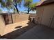 Enclosed backyard with block wall, small metal gate, and patio, offering privacy at 7905 W Thunderbird Rd # 307, Peoria, AZ 85381