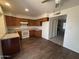 Well-lit kitchen showcases dark cabinetry, granite countertops, and newer white appliances at 7905 W Thunderbird Rd # 307, Peoria, AZ 85381