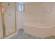 Bright bathroom featuring a shower stall and a large soaking tub for relaxation at 9043 N 14Th Dr, Phoenix, AZ 85021