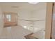 Upstairs hallway with tile floor leading to bedrooms at 9043 N 14Th Dr, Phoenix, AZ 85021
