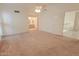 Spacious bedroom with a ceiling fan, ensuite bathroom, and walk in closet at 9043 N 14Th Dr, Phoenix, AZ 85021