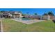 Community pool with lush green lawn and lounge chairs offers a refreshing escape on sunny days at 9043 N 14Th Dr, Phoenix, AZ 85021