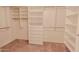 Spacious walk-in closet with built-in shelving and drawers at 9043 N 14Th Dr, Phoenix, AZ 85021