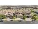 Residential neighborhood with manicured lawns and houses with two-car garages and tile roofs at 9727 E Torino Ave, Mesa, AZ 85212