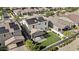 Aerial view of a home with solar panels, pergola, and artificial turf at 9727 E Torino Ave, Mesa, AZ 85212