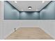 Finished basement with wainscoting, recessed lighting, and neutral decor offers a versatile space at 9727 E Torino Ave, Mesa, AZ 85212