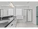 Bathroom featuring dual sinks, a bathtub, and shower with glass door at 9727 E Torino Ave, Mesa, AZ 85212