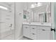 Bright bathroom featuring a double vanity, and shower-tub combination at 9727 E Torino Ave, Mesa, AZ 85212
