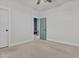 This bedroom features neutral walls and carpets and a ceiling fan at 9727 E Torino Ave, Mesa, AZ 85212