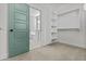 Bedroom closet with wall shelving and neutral carpet at 9727 E Torino Ave, Mesa, AZ 85212