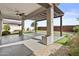 This covered patio has pavers, ceiling fan and pergola, creating an inviting outdoor living space at 9727 E Torino Ave, Mesa, AZ 85212