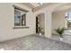 Inviting entrance featuring an arched entryway, elegant light fixtures and potted plants at 9727 E Torino Ave, Mesa, AZ 85212