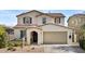 Charming two-story home featuring a neutral color palette and a spacious two-car garage at 9727 E Torino Ave, Mesa, AZ 85212