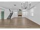 Spacious open-concept living room features a fireplace, ceiling fan and staircase to the second floor at 9727 E Torino Ave, Mesa, AZ 85212