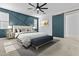 Beautiful main bedroom featuring decor, updated window coverings, and a sliding barn door to the bathroom at 9727 E Torino Ave, Mesa, AZ 85212